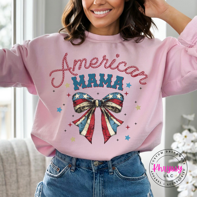 Light Pink crewneck sweatshirt with an American Mama script and patriotic flag bow.