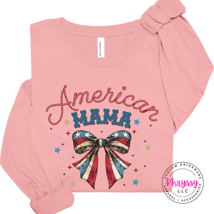 Pink long-sleeve shirt with 'American Mama' text and bow design on a white background