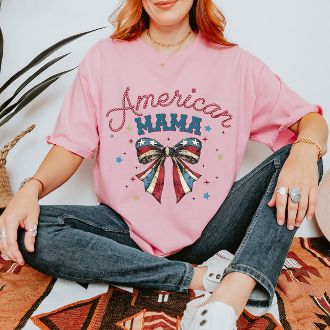 Blossom garment-dyed tee with a patriotic American Mama flag-bow graphic on the chest.