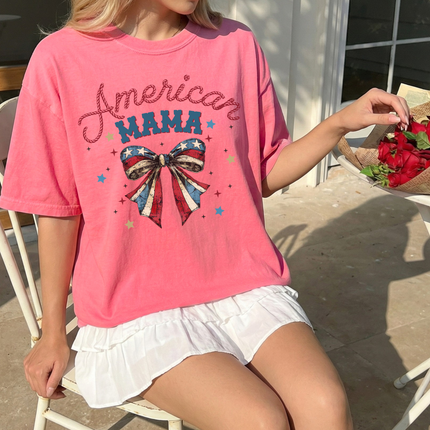 Peony garment-dyed tee showing a red and navy American Mama flag-bow design.