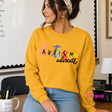 Cozy Gold sweatshirt with colorful autism advocate graphic.