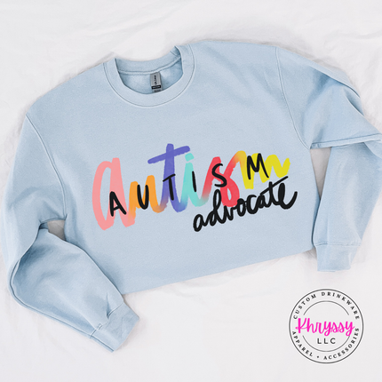 Colorful rainbow script graphic on a heavyweight Light Blue pullover sweatshirt.