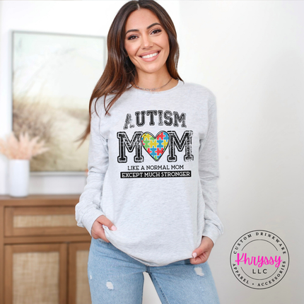 Ash long sleeve tee with a colorful puzzle-piece heart autism mom graphic.