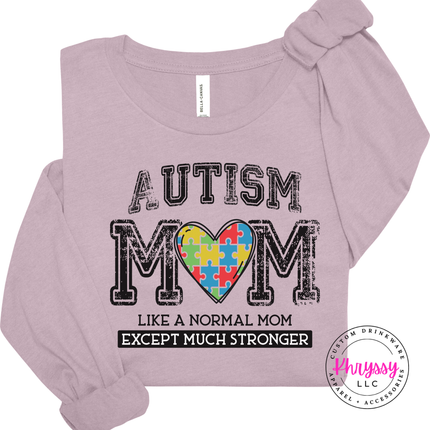 Close-up of a rainbow puzzle-piece heart graphic on a Light Violet colored long sleeve.