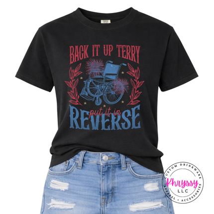 Black t-shirt with graphic design and text, paired with blue jeans on a white background.