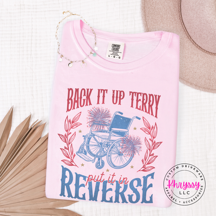 Blossom t-shirt with wheelchair graphic and text on a white surface with accessories.