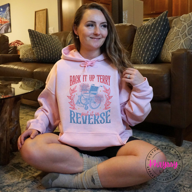 pink green hoodie showing the put it in reverse fireworks and floral humor design