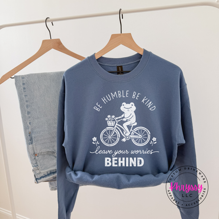 Indigo Blue crewneck sweatshirt on a hanger with the white frog on a bike
