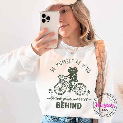 White crewneck sweatshirt with the be humble be kind frog on a bike
