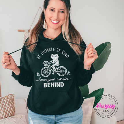 Black hoodie featuring a white frog riding a bike with be humble be kind