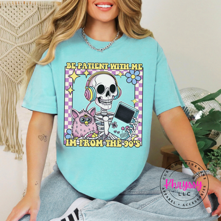 Pigment-dyed 90s nostalgia tee with colorful skeleton headphones be patient graphic