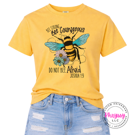 Yellow t-shirt with bee graphic and motivational text on a white background