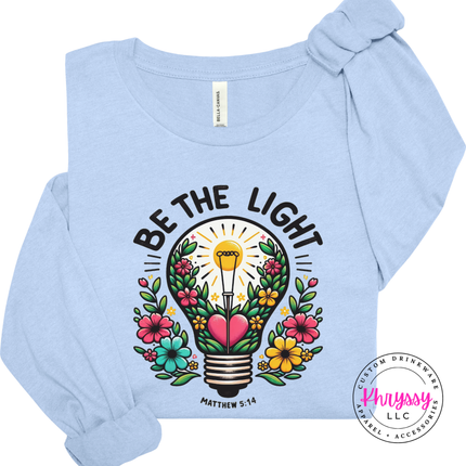 Baby Blue long sleeve tee featuring a colorful flower-filled lightbulb graphic