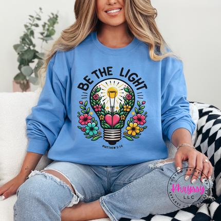 Carolina Blue crewneck sweatshirt featuring a flower-filled lightbulb graphic