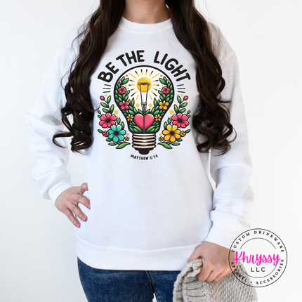 White crewneck sweatshirt with a bright floral lightbulb faith design