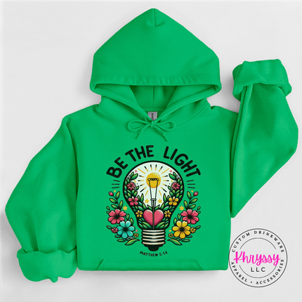 Irish Green hoodie with bold Be The Light lettering above a floral bulb