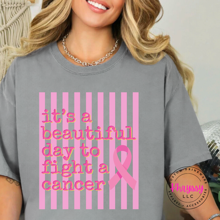 Gray tee hanging on a rack showing the beautiful day to fight cancer ribbon design
