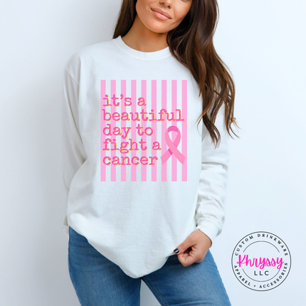 Folded White long sleeve tee featuring the beautiful day to fight cancer ribbon design