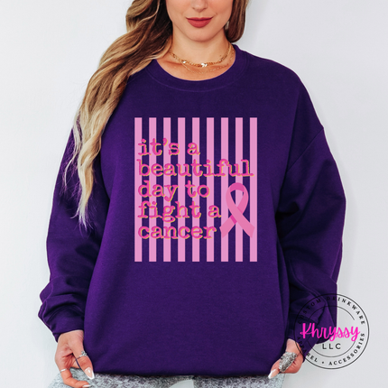 Purple crewneck sweatshirt featuring the beautiful day to fight cancer ribbon design