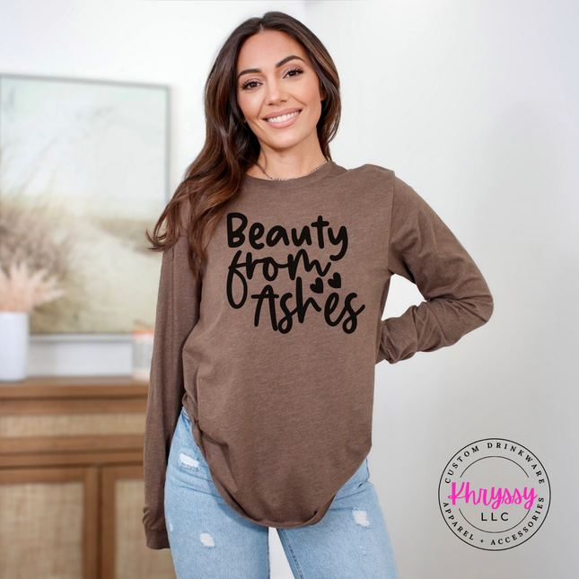 Heather brown long sleeve tee featuring a flowing faith redemption design