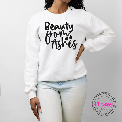 White crewneck sweatshirt with Beauty From Ashes script and heart accents