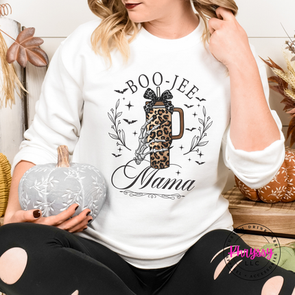 Woman wearing an white crewneck sweatshirt with a boo-jee mama design.