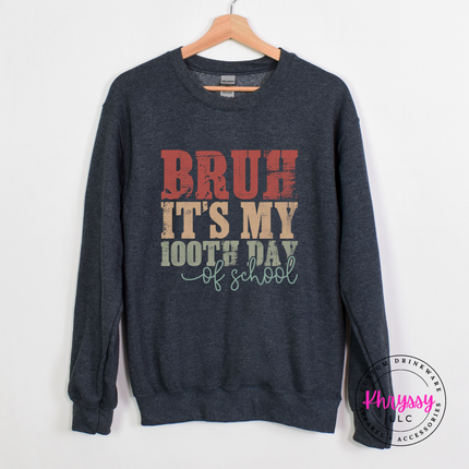 Dark heather cozy crewneck styled with a weathered bruh 100th day graphic.