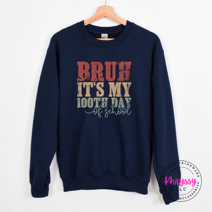 Navy crewneck sweatshirt showing a vintage distressed 100 days print.