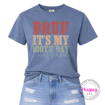 Blue jean garment-dyed tee featuring a retro 100 days milestone design.