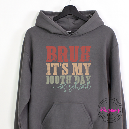 Charcoal hoodie featuring a retro 100 days milestone design.
