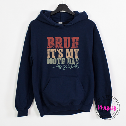 Navy pullover hoodie showing a vintage distressed 100 days print.