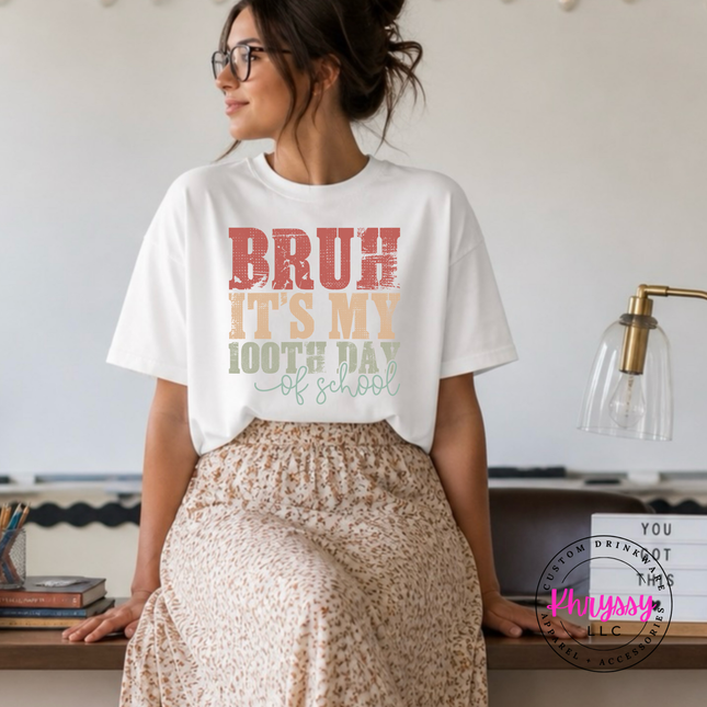 white tee with an earthy retro 100th day celebration design.