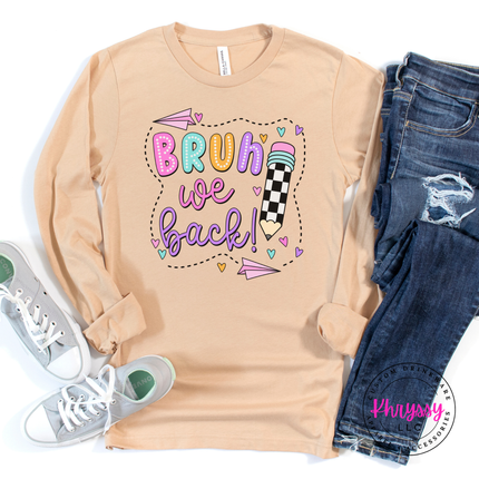 Sand dune teacher tee with a bright pastel first-day-of-school print.