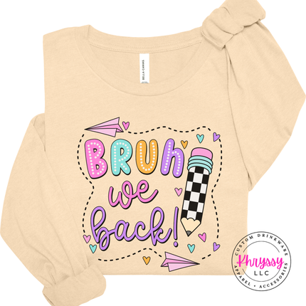Soft cream tee showing playful Bruh We Back classroom lettering.