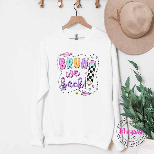 White heavyweight teacher crewneck with a bright first-day-of-school print.