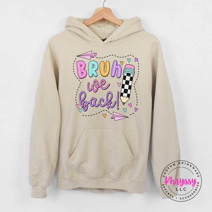 Sand hoodie showing a bright pastel first-day-of-school graphic.