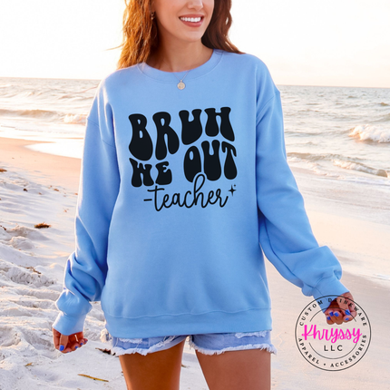 Woman wearing a Carolina Blue crewneck with the Bruh We Out graphic.