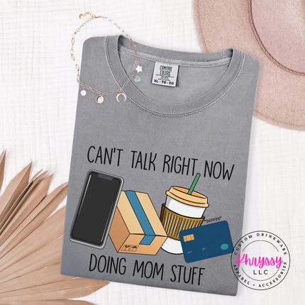 Grey tee showing the funny can't talk right now doing mom stuff graphic