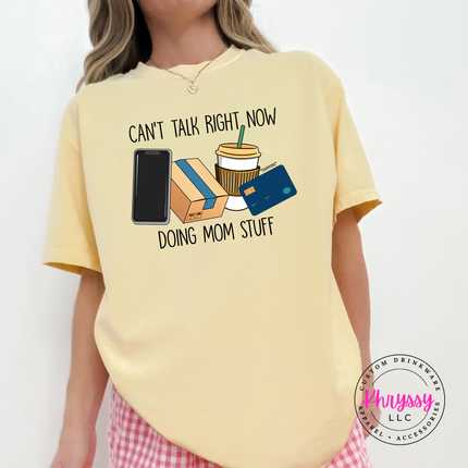 Butter tee featuring the funny doing mom stuff design with coffee and phone