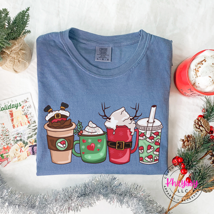 Woman wearing the Christmas coffee cups tee in Blue Jean.
