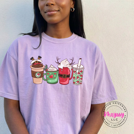 Woman wearing the Christmas coffee cups tee in Orchid.

