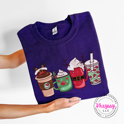 Purple crewneck sweatshirt with four festive Christmas coffee cups and lattes.
