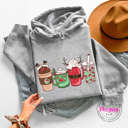 Woman wearing the Christmas coffee cups hoodie in Sport Gray.