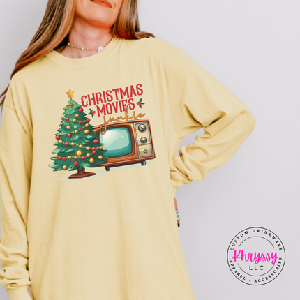 Model wearing the Christmas movie junkie long sleeve tee in Butter.