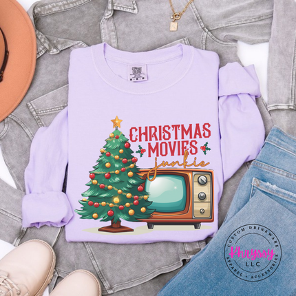 Close up of the Christmas movie junkie art on an Orchid long sleeve tee.