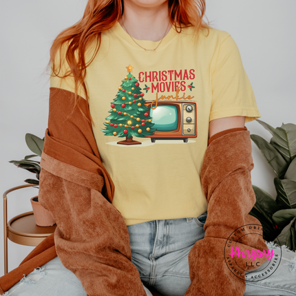 Model wearing the Christmas movie junkie tee in Butter.