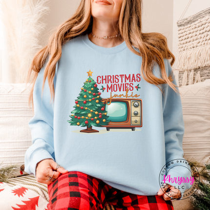 Model wearing the Christmas movie junkie crewneck sweatshirt in Carolina Blue.