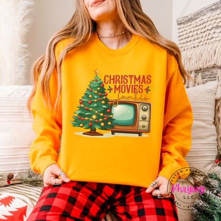 Close up of the Christmas movie junkie art on a Gold crewneck sweatshirt.