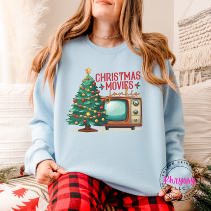 Light Blue crewneck sweatshirt showing a retro TV beside a decorated tree.
