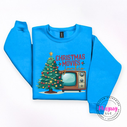 Model wearing the Christmas movie junkie crewneck sweatshirt in Sapphire.